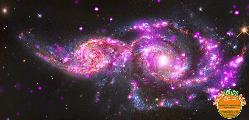 Imagens dos telesc�pios Chandra, Hubble e Spitzer mostram a colis�o entre as gal�xias NGC 2207 e IC 2163, que fica a cerca de 130 milh�es de anos-luz na constela��o de C�o Maior. Cr�ditos: Chandra / Hubble / Spitzer, NASA / JPL-Caltech
